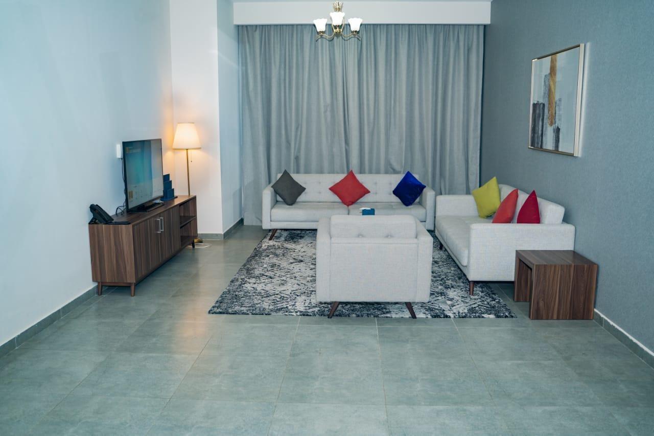Luxe Grand Hotel Apartments 샤르자 외부 사진 A living room