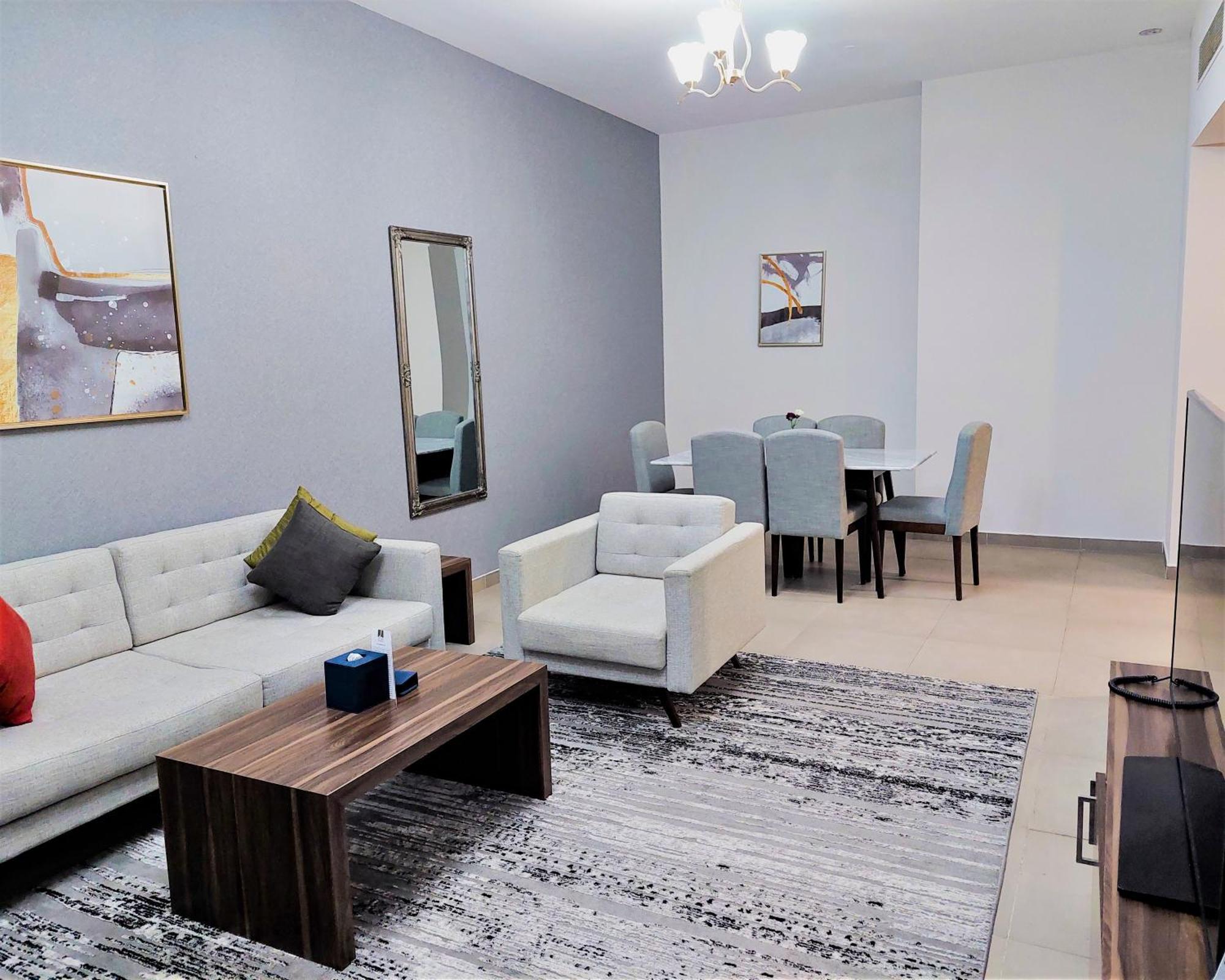 Luxe Grand Hotel Apartments 샤르자 외부 사진 A living room in a typical apartment